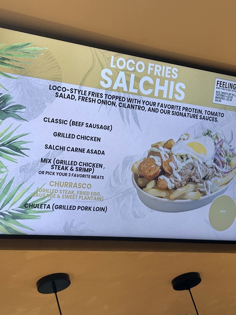 Menu board with fries, bowls, and juices.