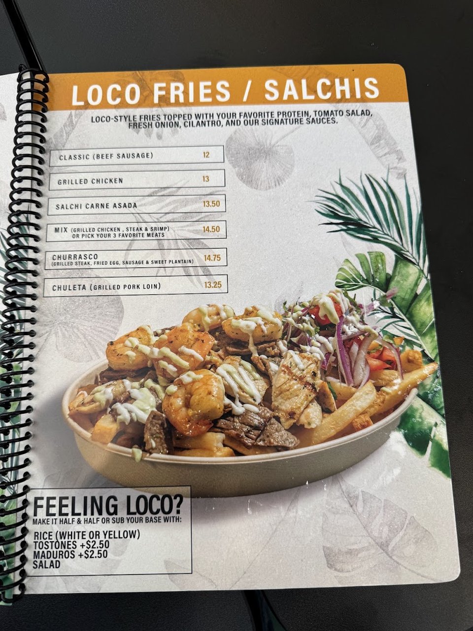 Printed menu showing small plates and drinks.